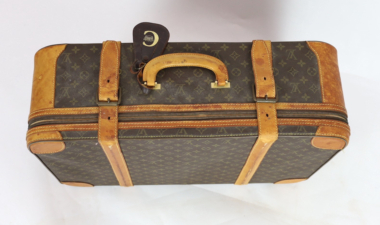 A 1980/90s Louis Vuitton canvas monogram suitcase, 59cm wide, 46cm deep, 23cm high